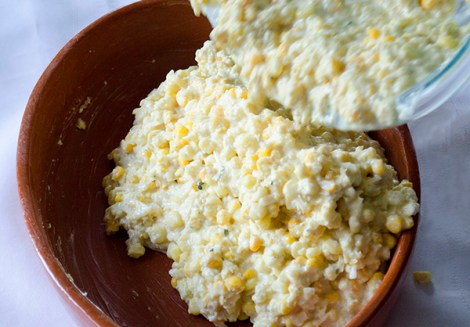 Pouring corn pudding batter